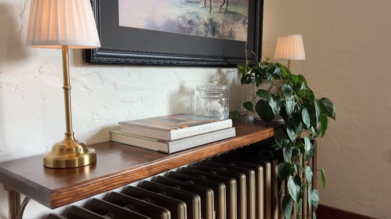 Decorative wooden shelf over radiator