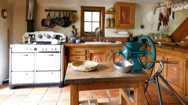 Kitchen with adobe walls and rustic decor