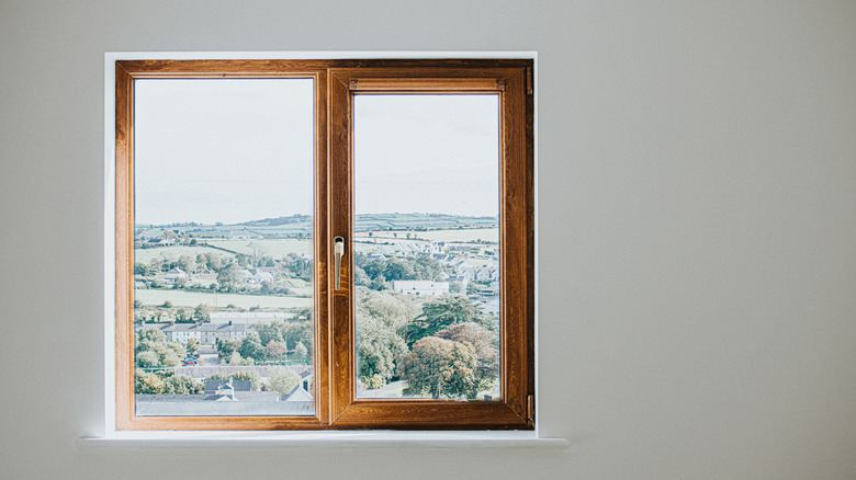 plain wooden frame window on white wall