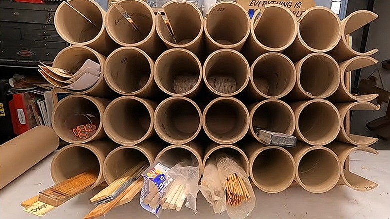 The completed garage storage unit made using cardboard tubes and a drawer
