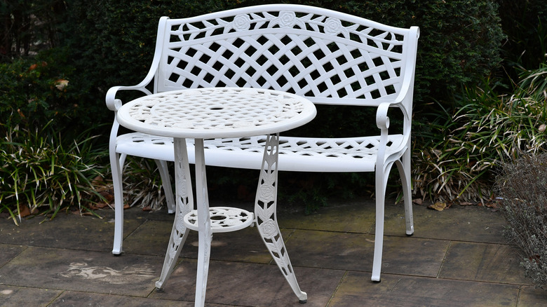Vintage cast iron patio furniture that has been repainted to give it new life