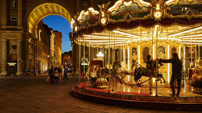 A lighted carousel at twilight