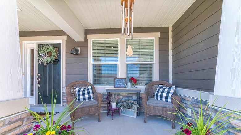 A front porch with hanging decor