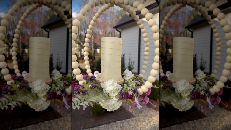 a whimsical porch hanging made from dollar tree items