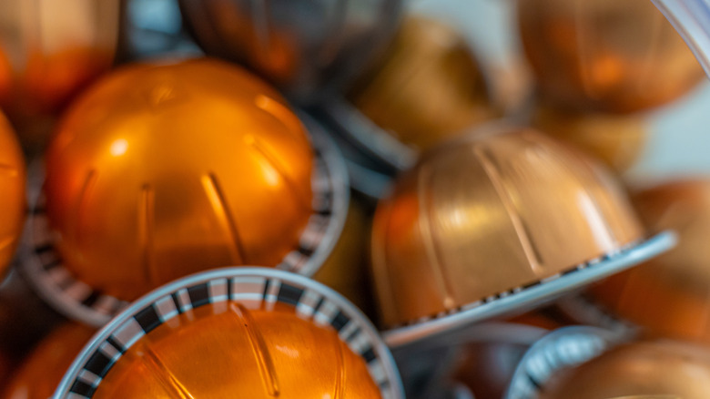 Coffee pods sit in a disorganized pile