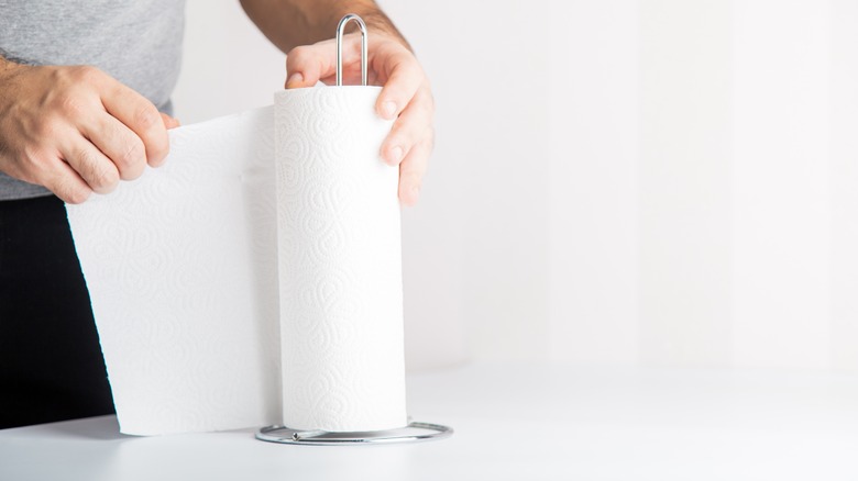 Man tearing off paper towel 