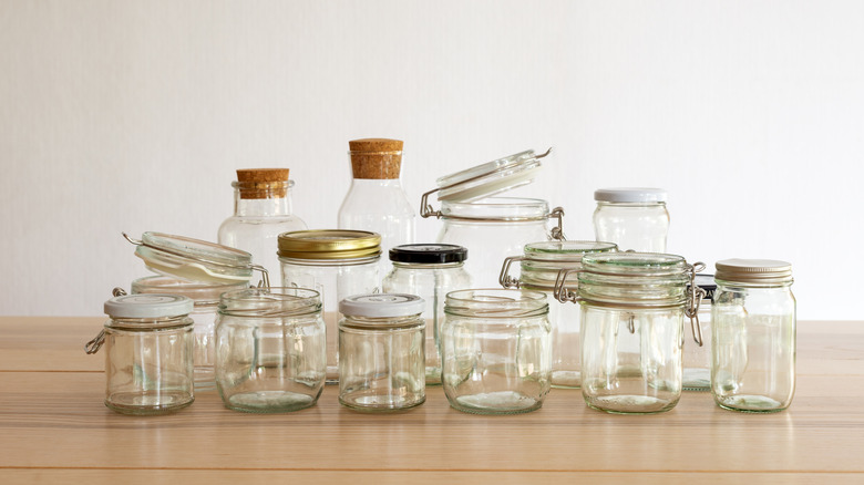 A table filled with empty jars