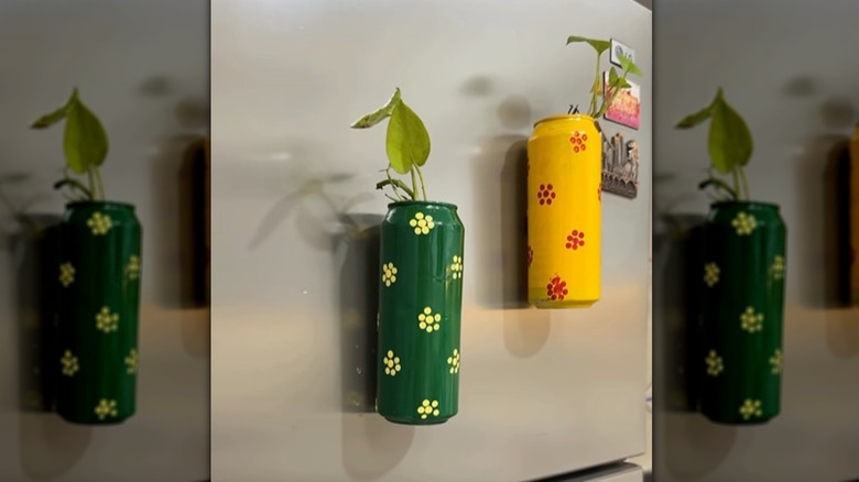 DIY planter made using an aluminum can holding some flowers