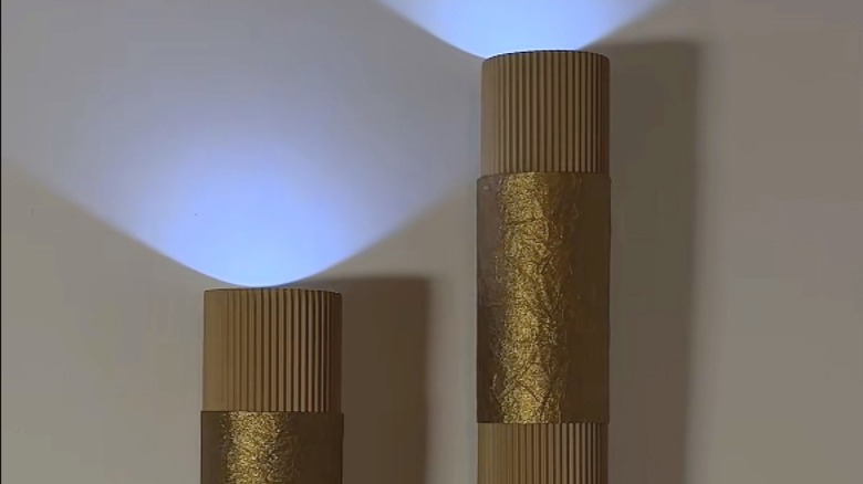 Wall sconces made out of Pringles cans