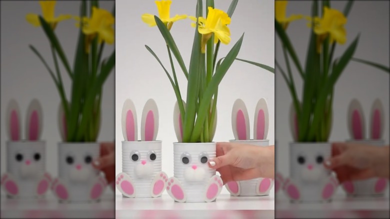 DIY bunny containers with daffodils inside.