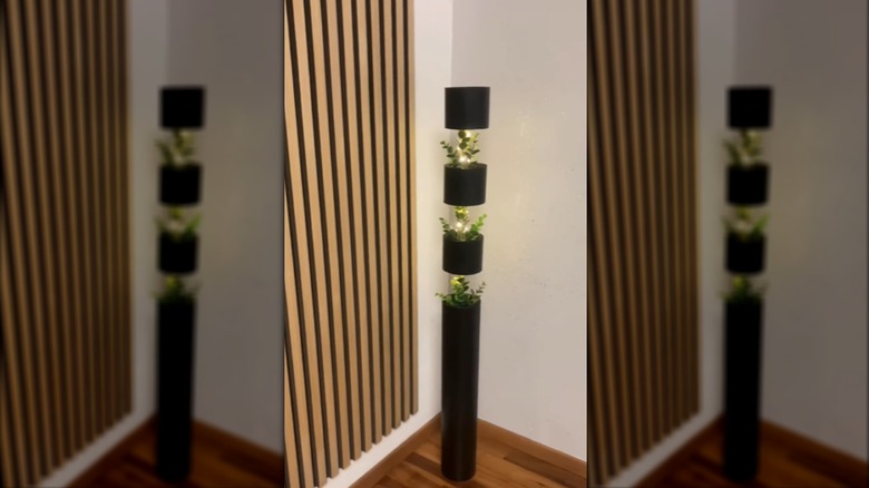 DIY vertical lighting feature made from empty tubes