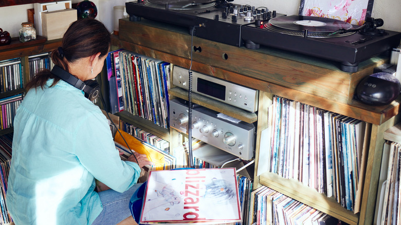 Woman looking through her record collection