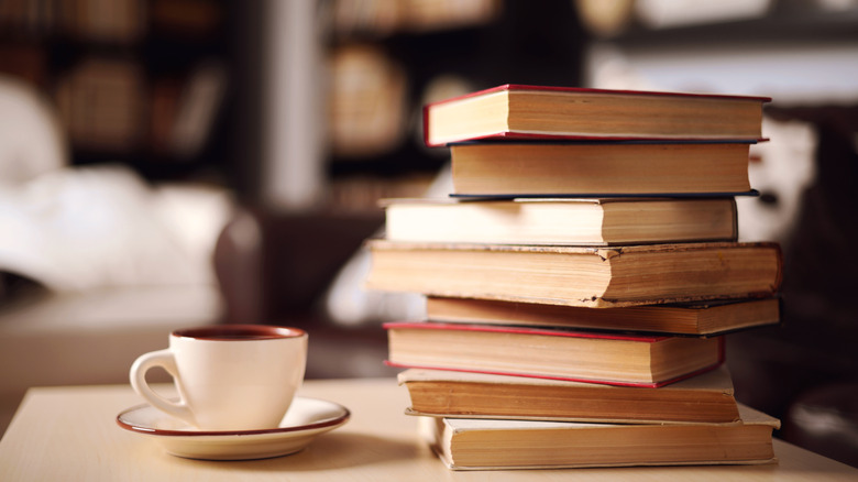 Stack of books and cup