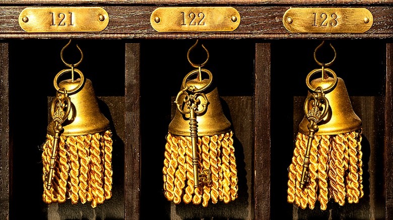 Pompoms adorned with old-fashioned keys on a box