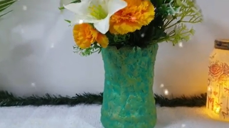 A green DIY decoupage vase