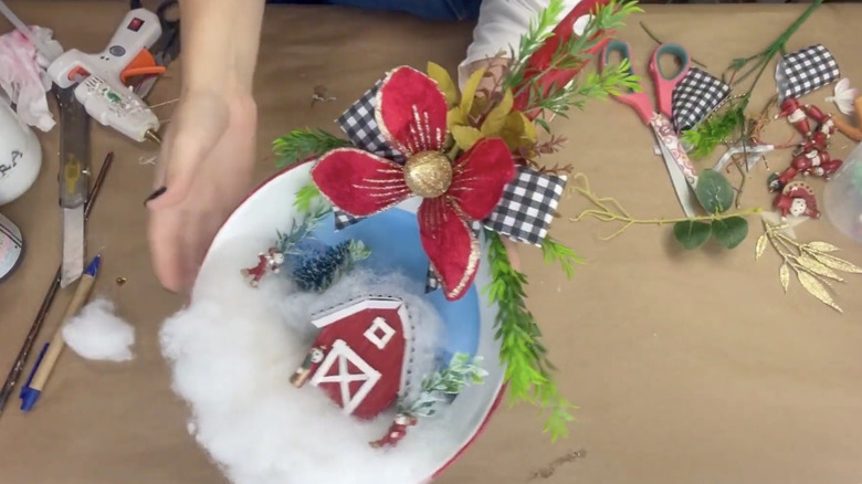 A winter scene created in the base of a frying pan.