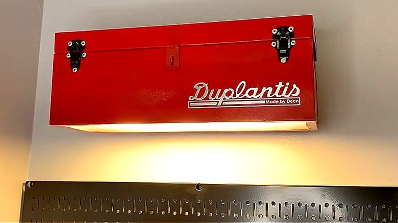 An overhead garage light made from an old toolbox