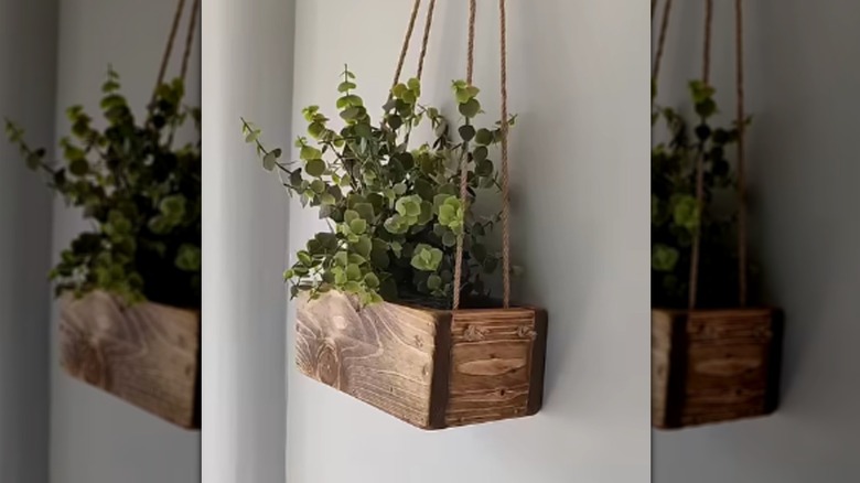 A hanging planter made from scrap wood