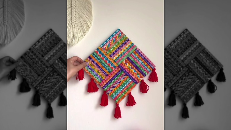 A piece of geometric art made from popsicle sticks