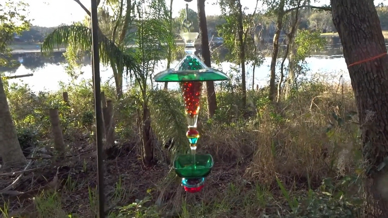 DIY bird feeder made with upcycled glassware