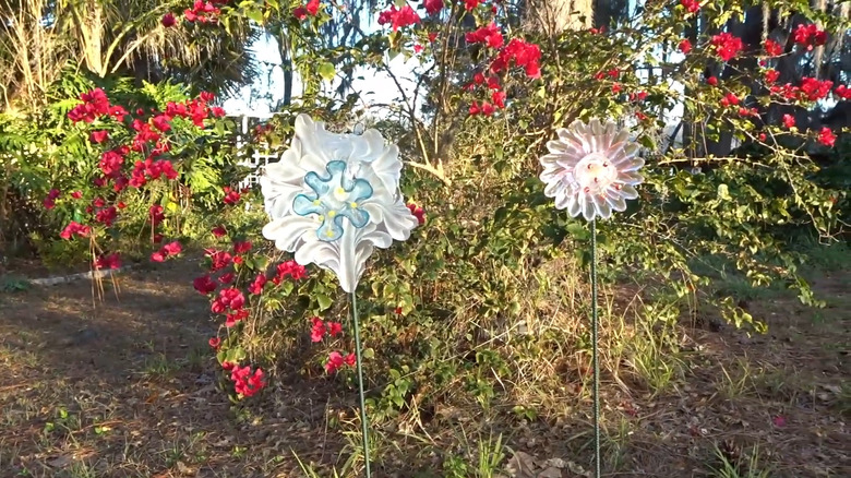 Glass flower suncatchers in garden