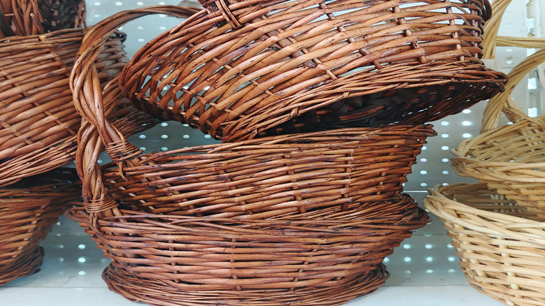 Wicker baskets stacked on a shelf at a thrift store