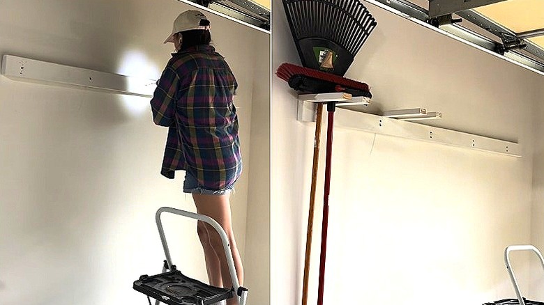 Split of DIYer adding a wood plank to a garage wall, and the first holders added, with a rake and broom hanging from the first one