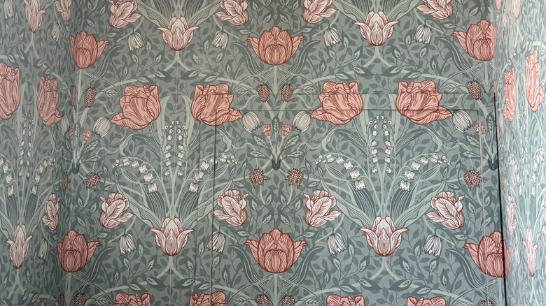 Closeup of pink and green floral wallpaper