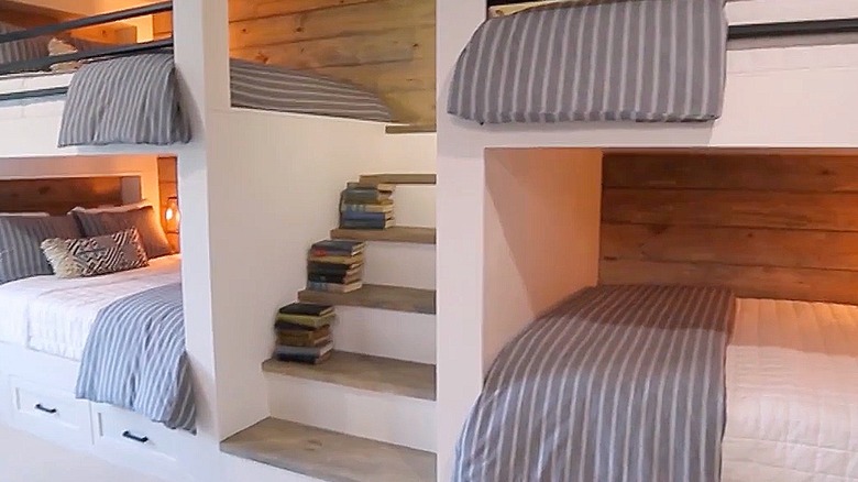 Four built-in bunk beds with a staircase