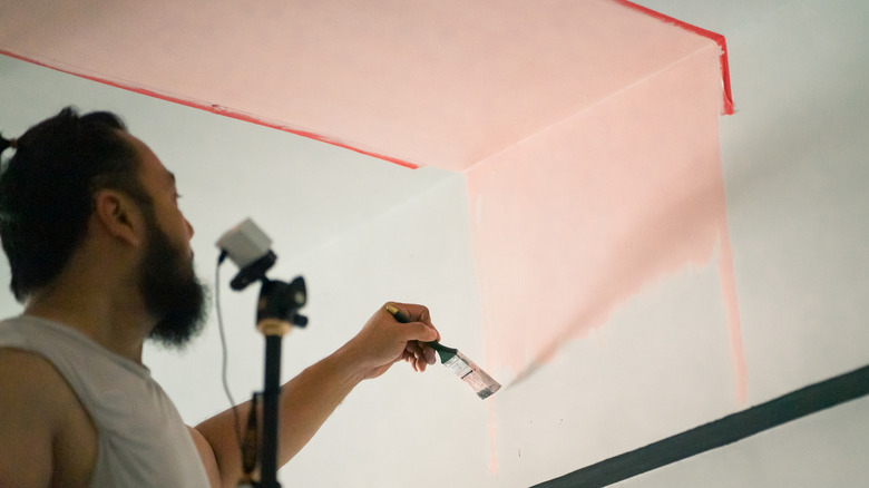 Someone painting the ceiling pink