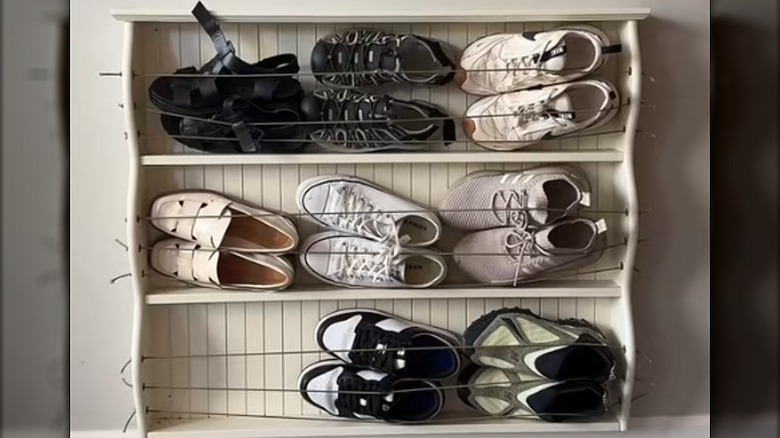 A simple shoe storage unit made from a bookcase to hold sandshoes and joggers