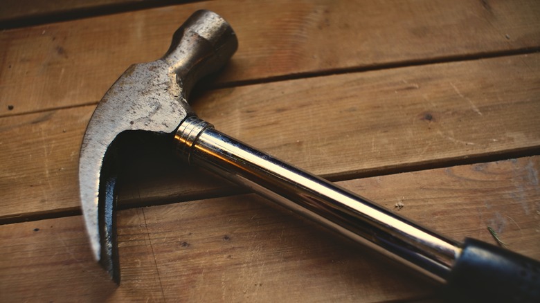 Hammer laying on a wooden table