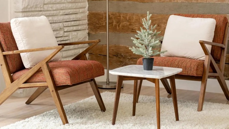 White textured rug paired with brown, textured, upholstered chairs