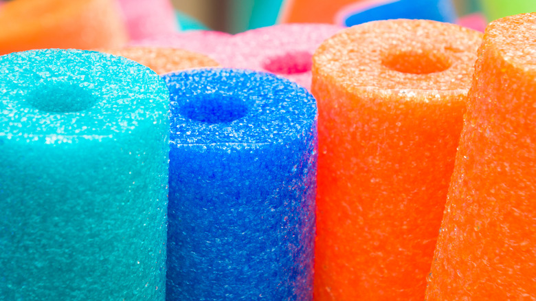 colorful pool noodles lined up