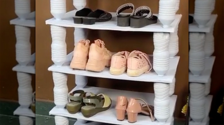 A shelf made of bottles and cardboard