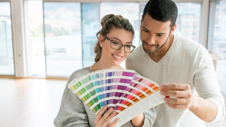 Couple looking at paint colors