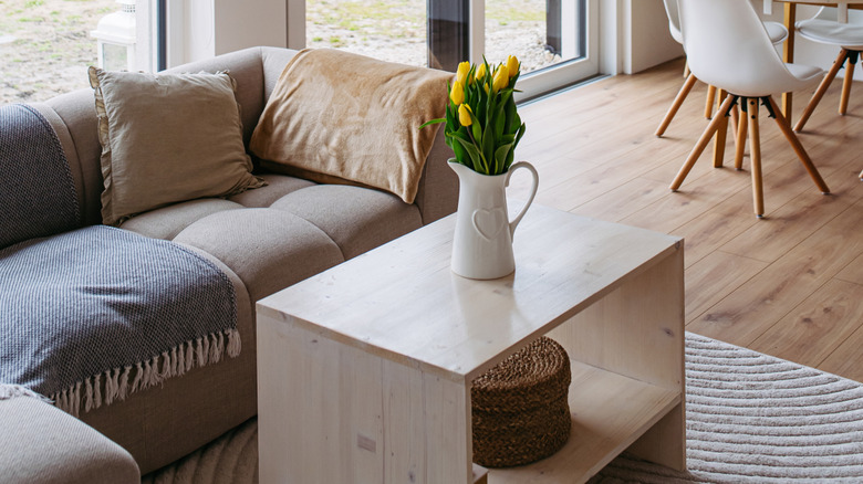 large, bulky couch and coffee table in small living room