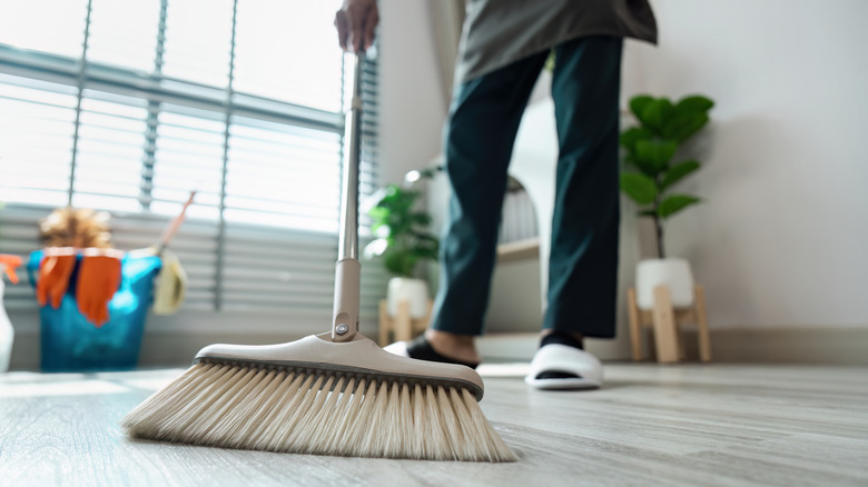 Man sweeping floor