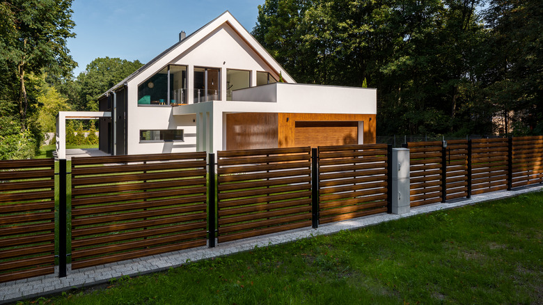 house with horizontal wood fence