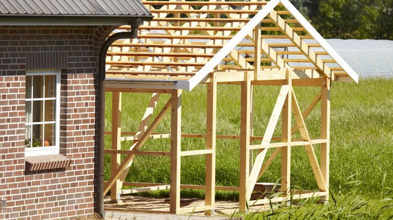 large white backyard shed in daytime