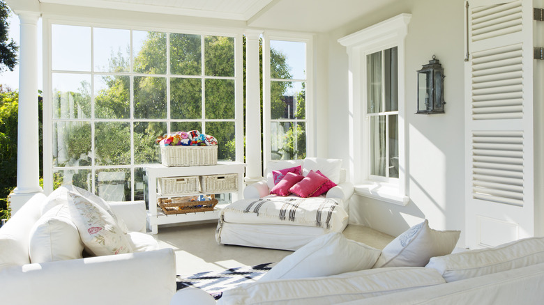 bright sunroom with seating