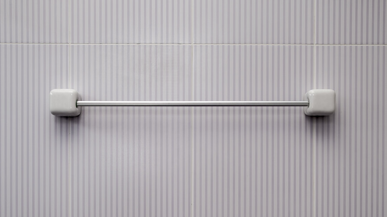 A towel bar with no obvious fasteners