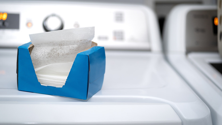 A box of dryer sheets on top of a washing machine