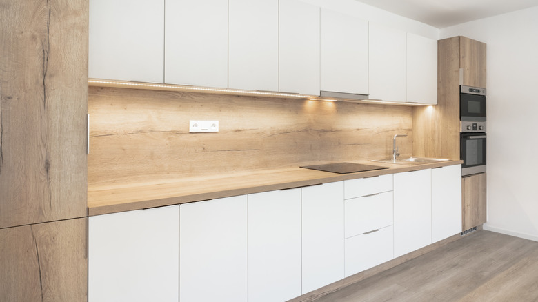 White modern kitchen with under-cabinet lighting