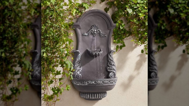 A hanging fountain for an outdoor wall