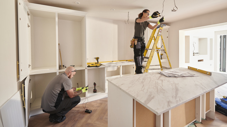 People working on a kitchen remodel