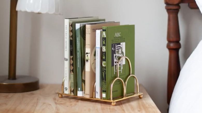 Books in metal toast rack