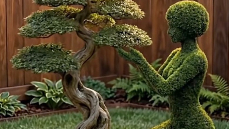 Topiary of a woman and a tree