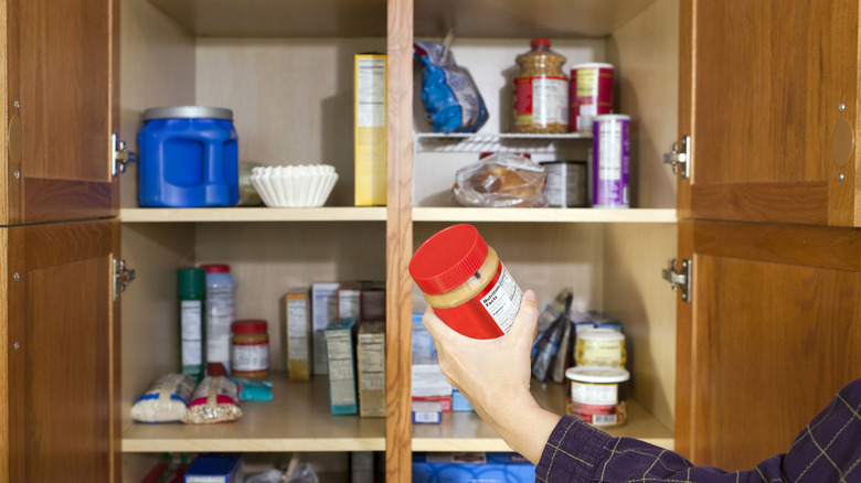 person holding jar 