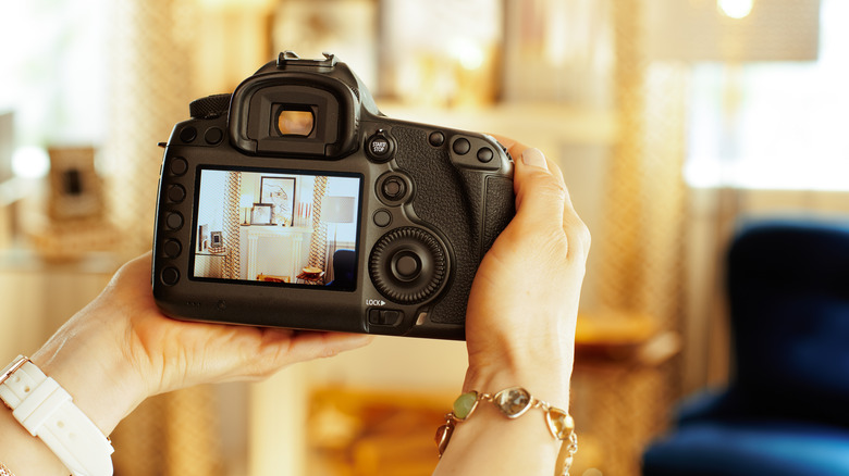 Hands holding digital camera